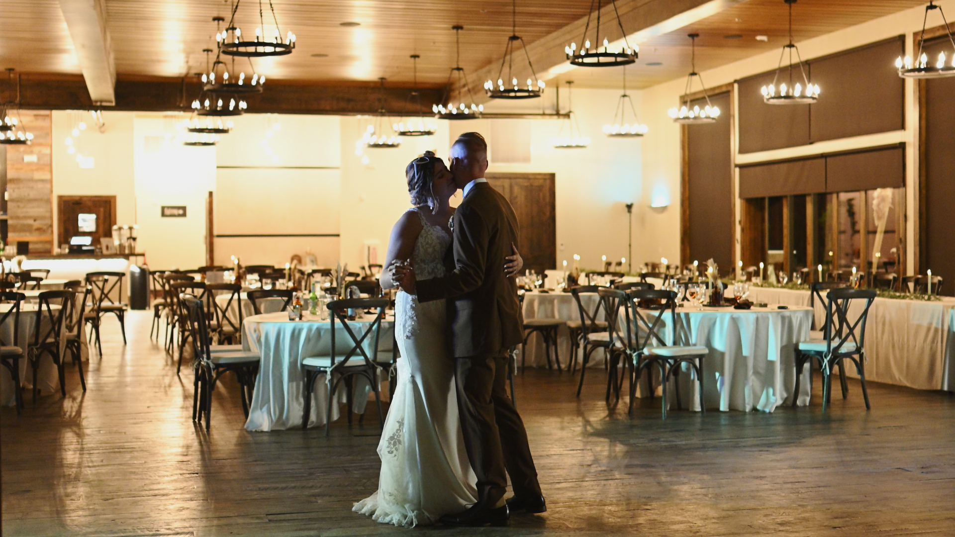 couple sharing their private last dance in their dining hall at the end of the evening 